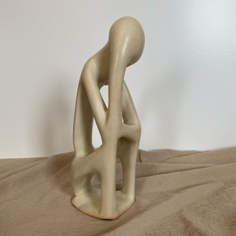 Thinking soapstone sculpture